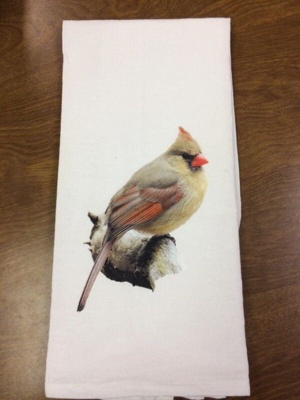 A painting of a bird on top of a table.