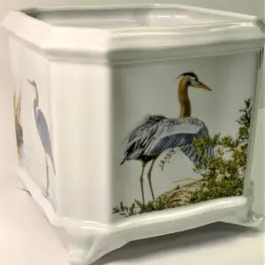 A square white vase with an image of birds.