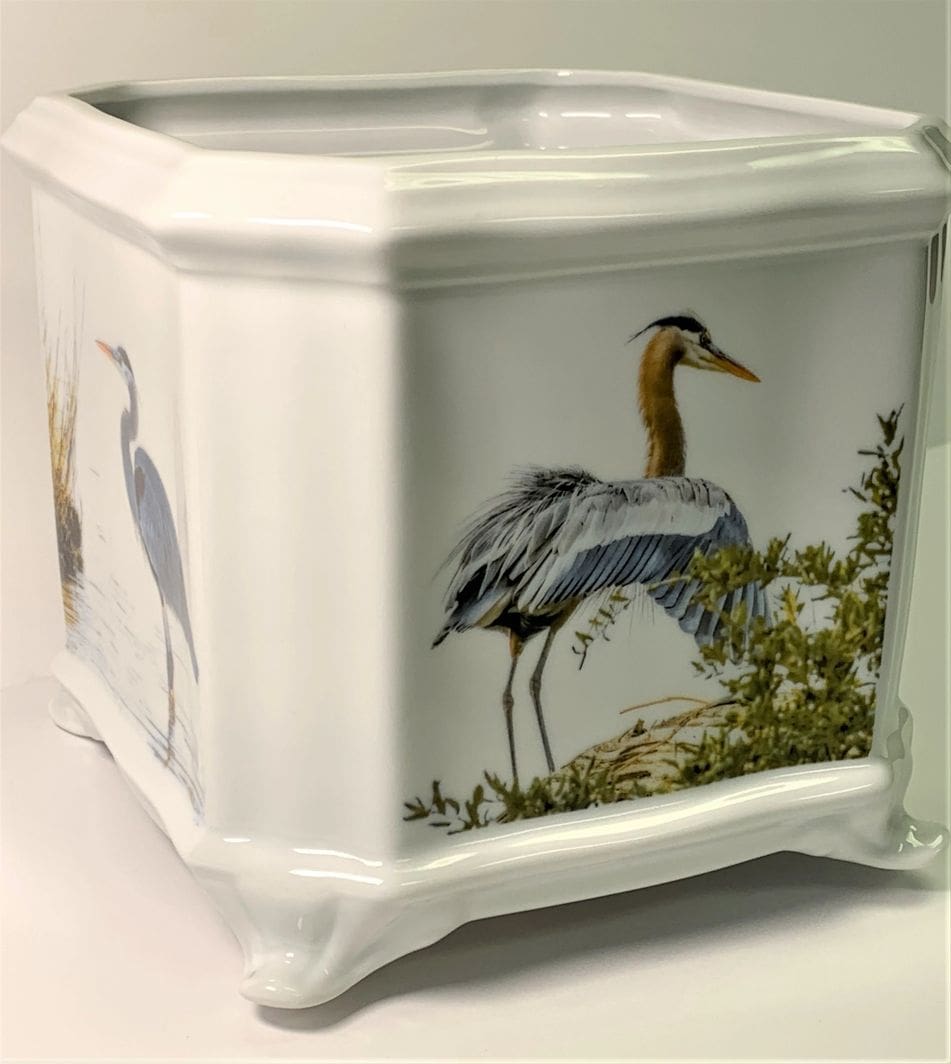 A square white vase with an image of birds.