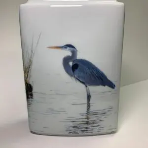 A blue heron standing in the water.