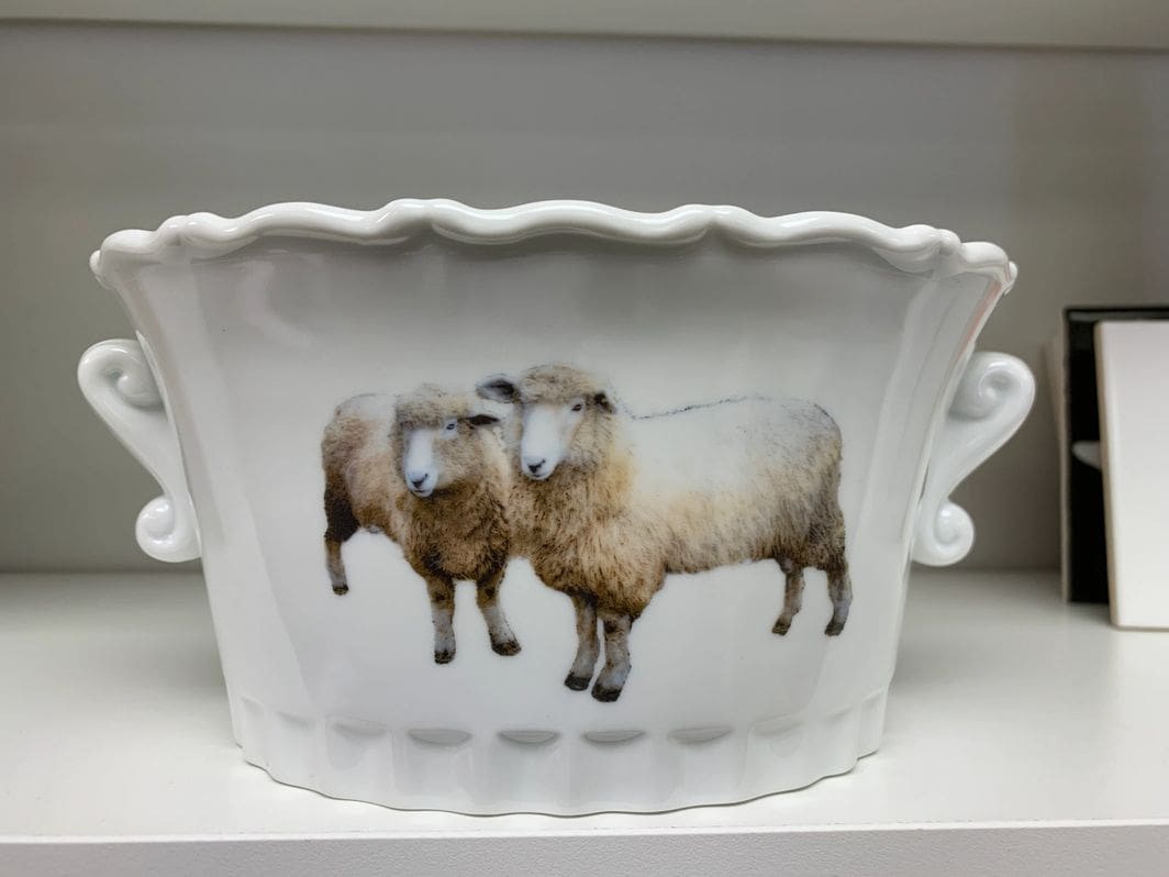 A bowl with two sheep on it